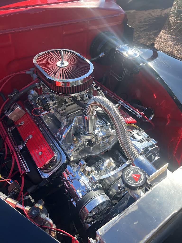 Detailed view of a polished engine in a red vehicle